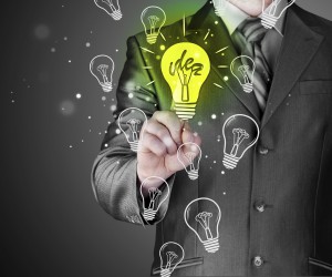 Business man touching light of idea